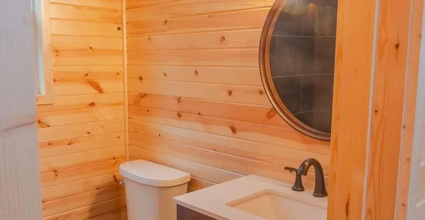 The Trailblazer bathroom with a tub and window